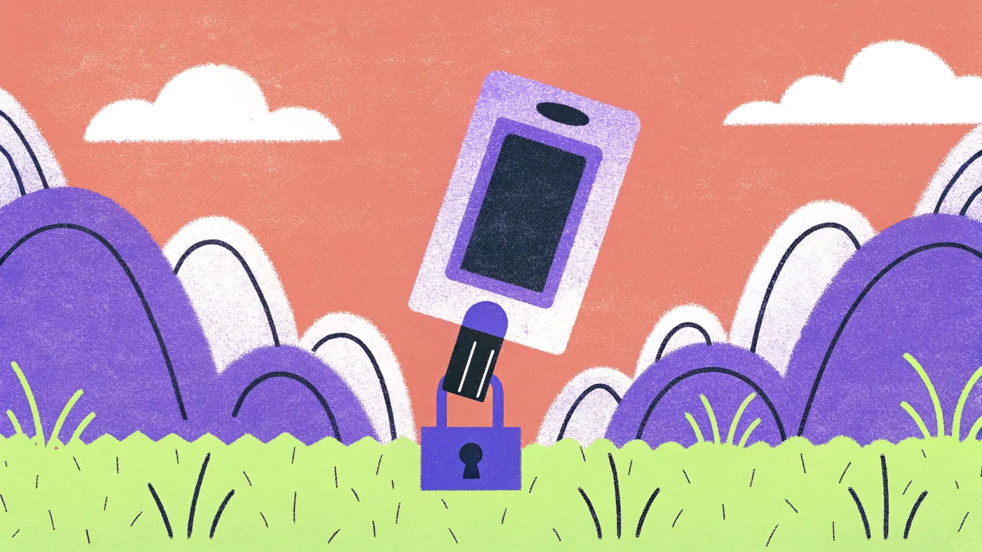 Een kleine hardware wallet die op een usb-stick lijkt, met een sleutel en een hangslot ernaast