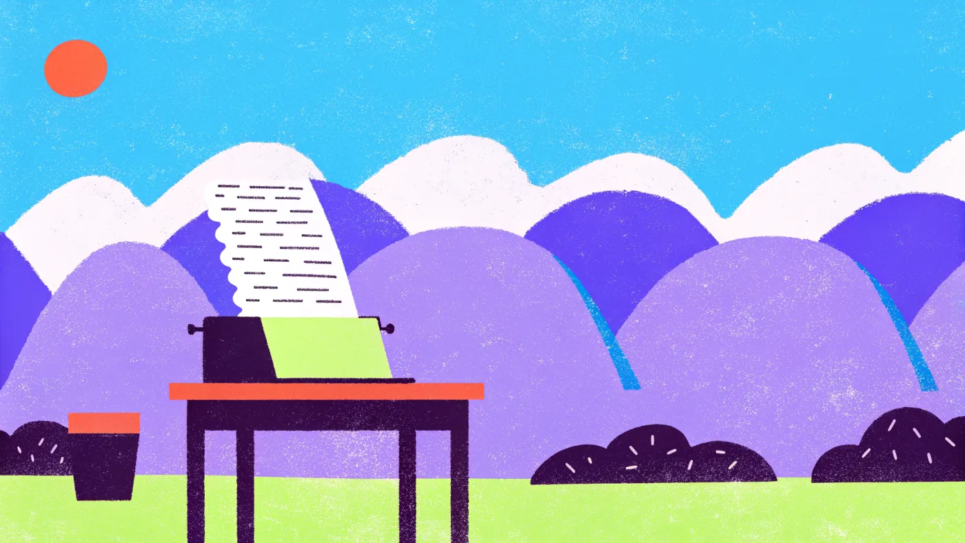Een ouderwetse typemachine met een vel papier en een laptop ernaast